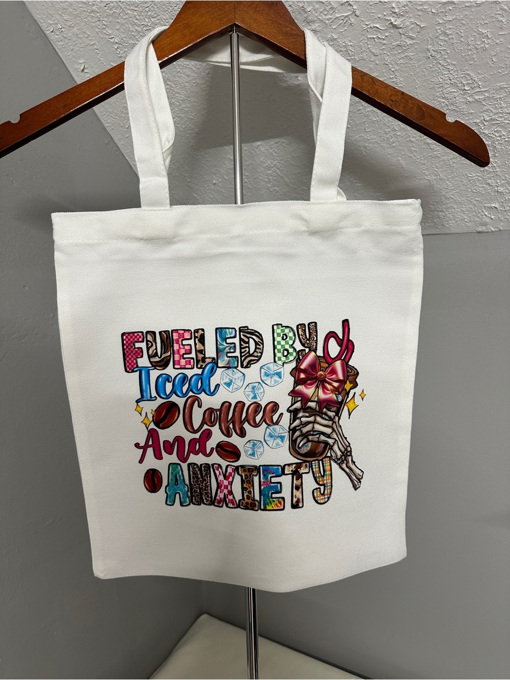 White Canvas Tote Bag with Colorful 'Fueled by Iced Coffee and Anxiety' Graphic